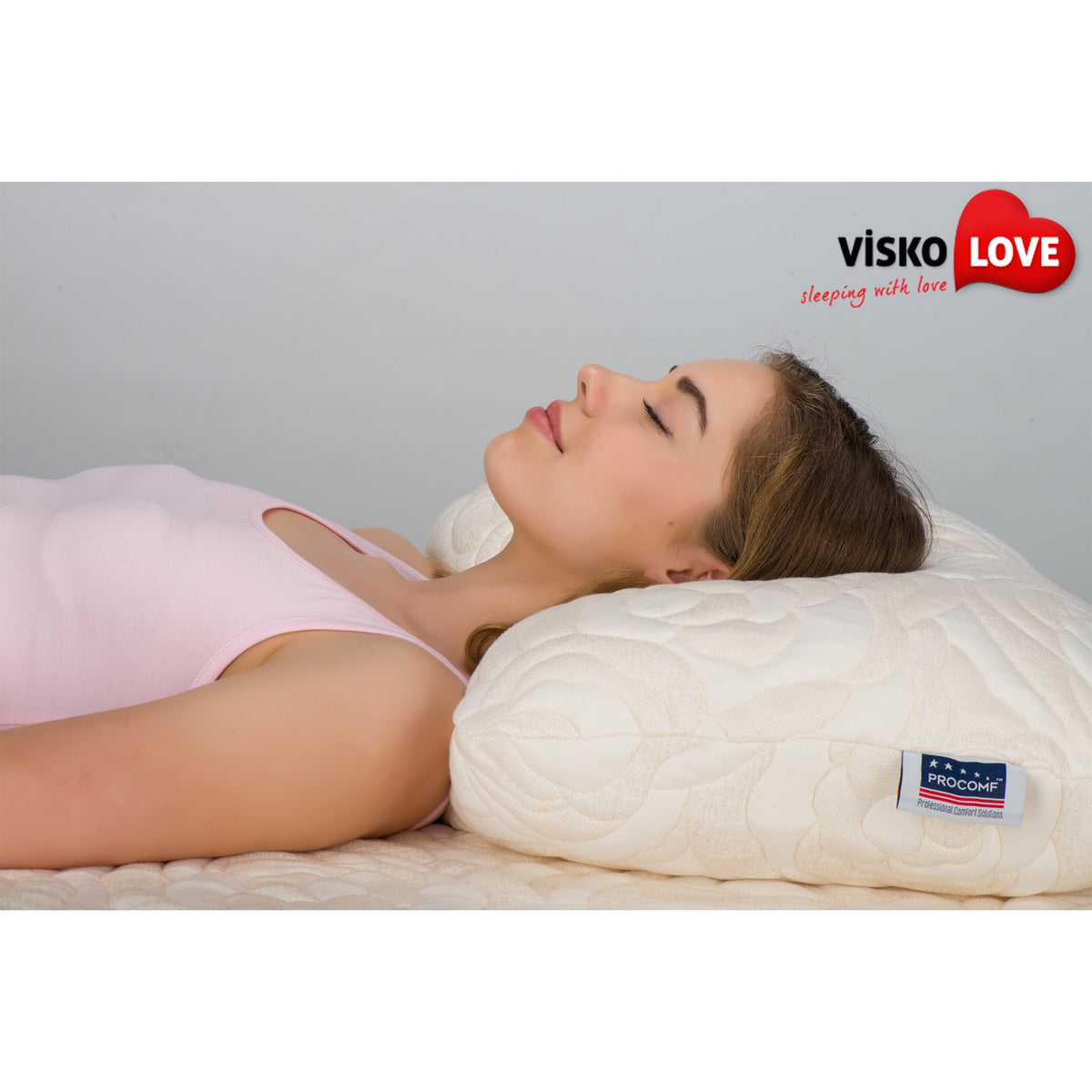 a girl laying on her stomach on a bed 