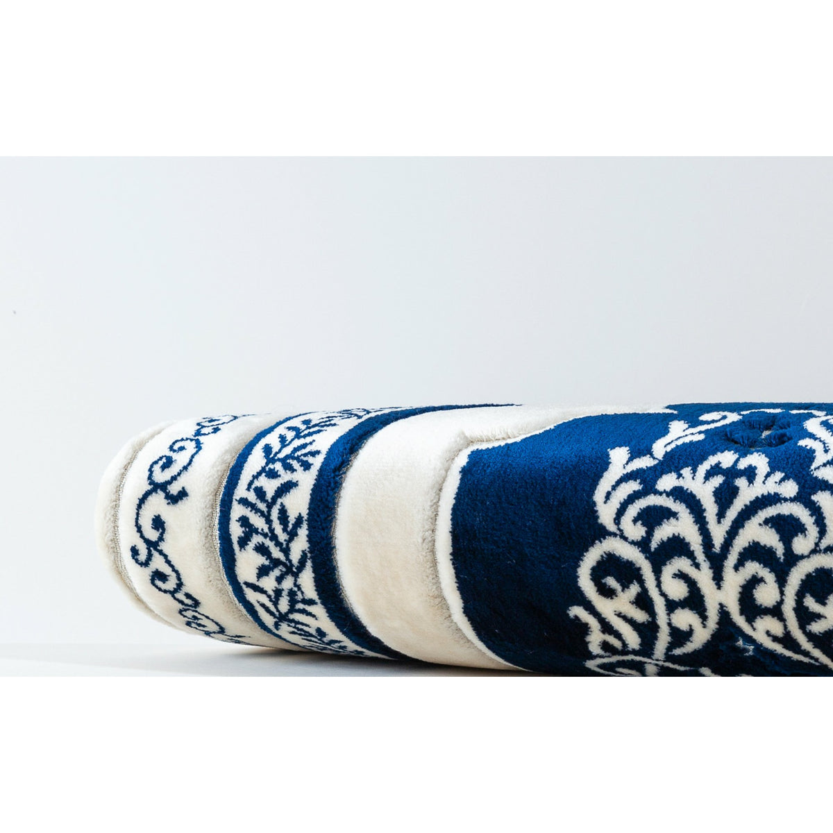 a bottle of &lt;unk&gt; sitting on top of a surfboard 