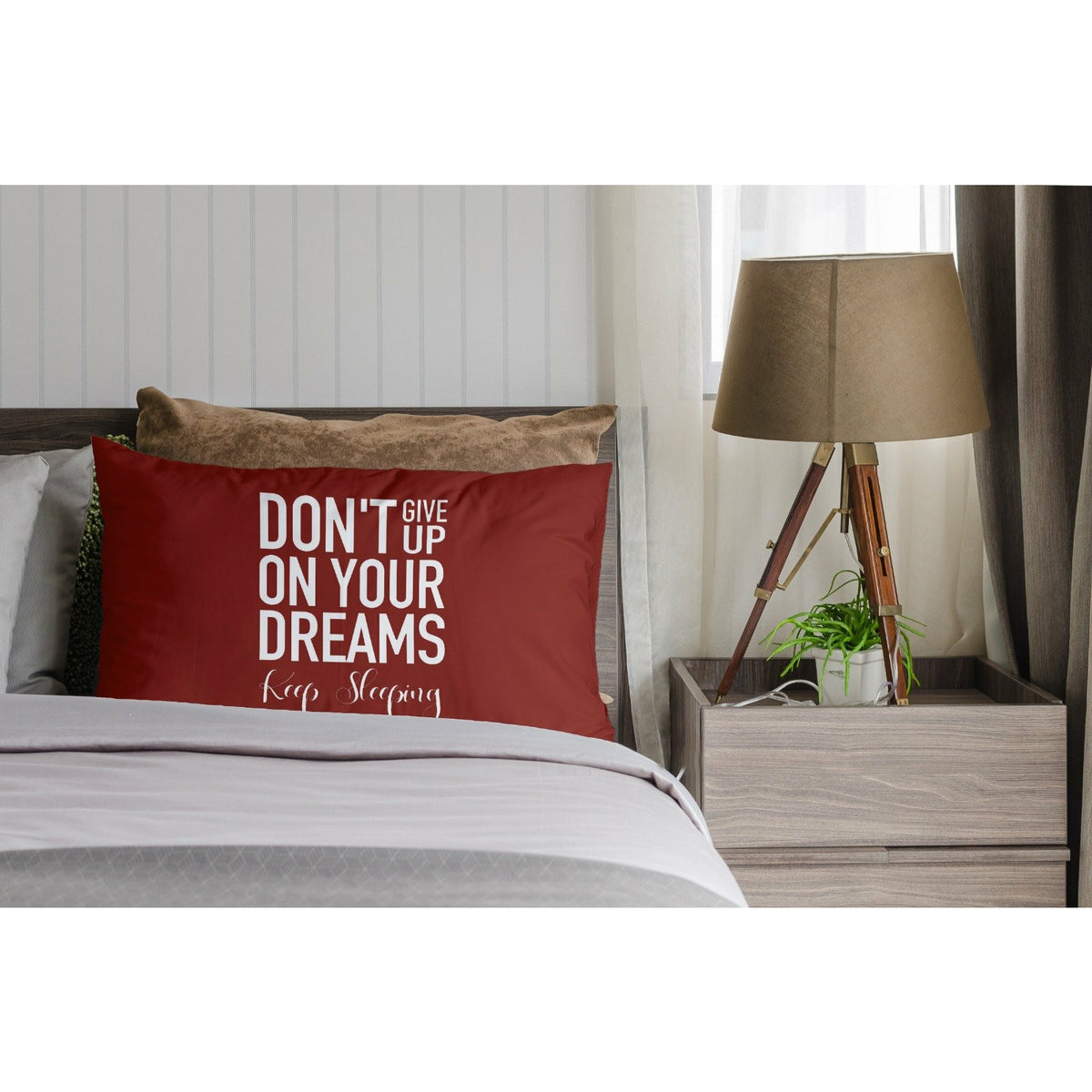 a bed sitting in a bedroom next to a lamp 